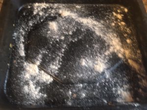 Sprinkle dry flour on the baking tray