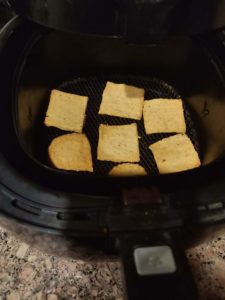 Preparing hummus crackers in air fryer