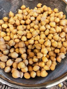Drain water from boiled chickpeas