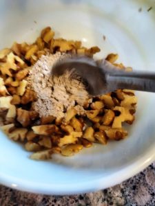 dust walnuts with dry ragi flour