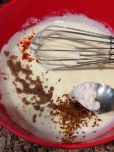 Whisk dahi and add spices