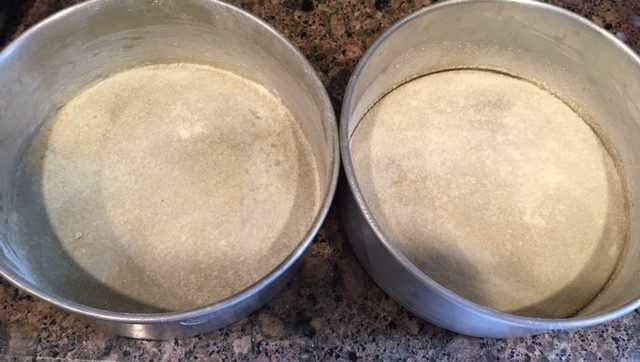 Greased and Dusted 2 baking pans of 6'' each