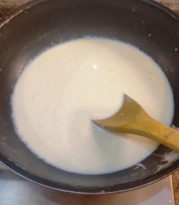 Heat milk to which cream and sugar is added